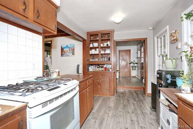 161 McNamara Road Spring Valley, NY 10977 - Photo 13 of 38 a kitchen with stainless steel appliances granite countertop a stove and a refrigerator