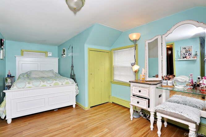 161 McNamara Road Spring Valley, NY 10977 - Photo 21 of 38 a bedroom with a bed and furniture