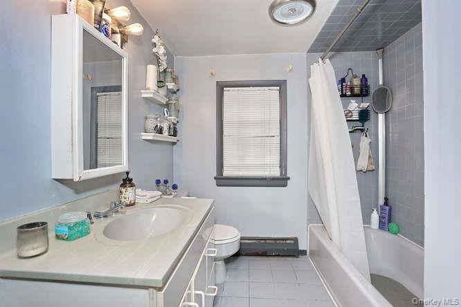 161 McNamara Road Spring Valley, NY 10977 - Photo 25 of 38 a bathroom with a sink toilet and shower