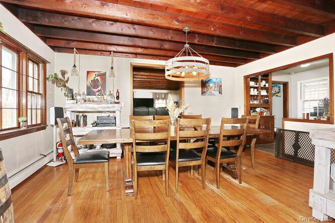 161 McNamara Road Spring Valley, NY 10977 - Photo 9 of 38 a view of a dining room with furniture and wooden floor