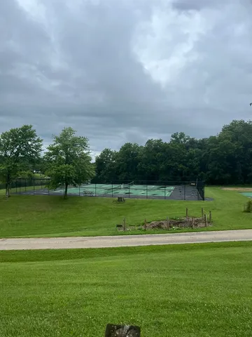 a view of a golf course with a lake