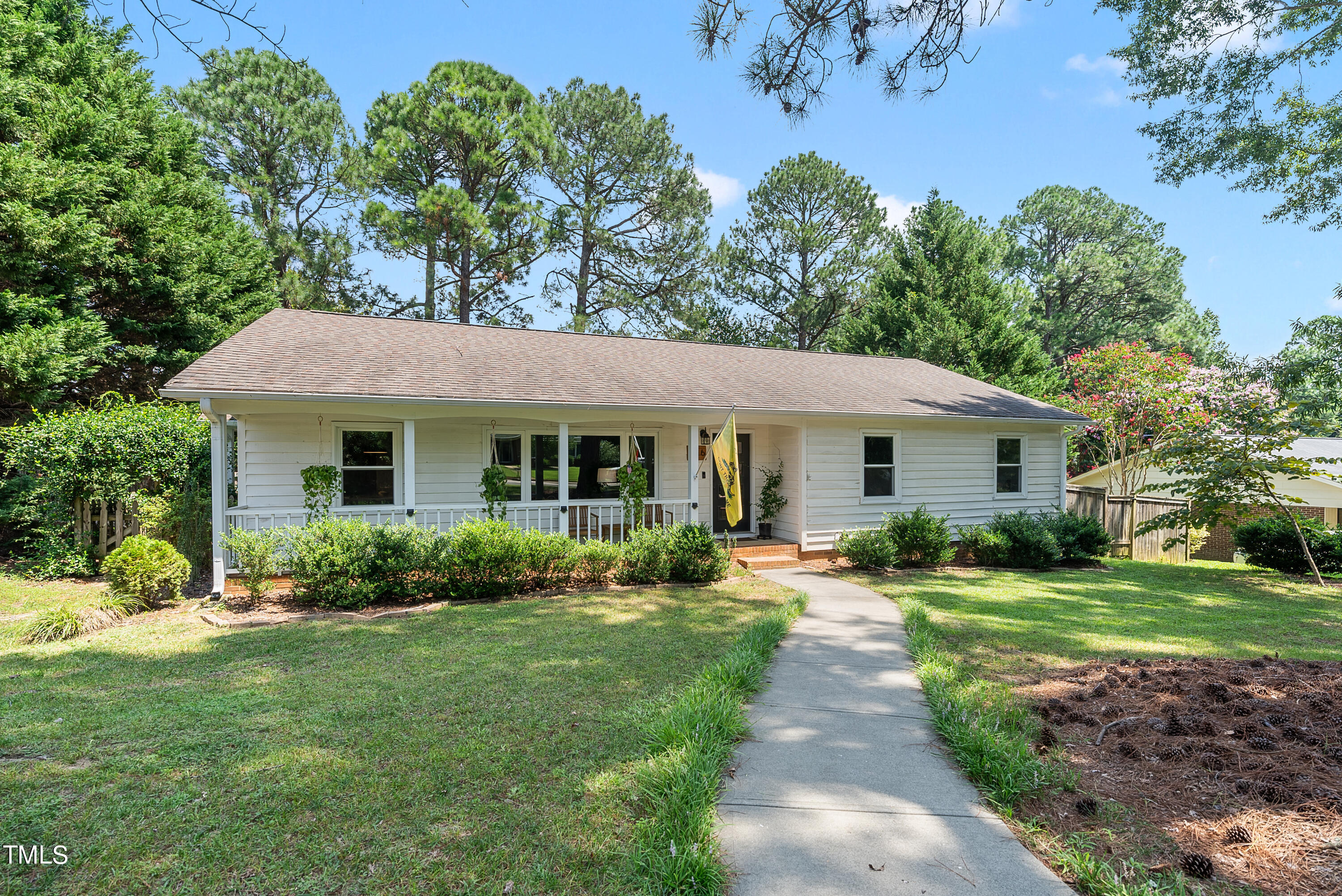 3116 Carovel Court Raleigh, NC 27612 - Photo 1 of 25 a front view of a house with garden and porch