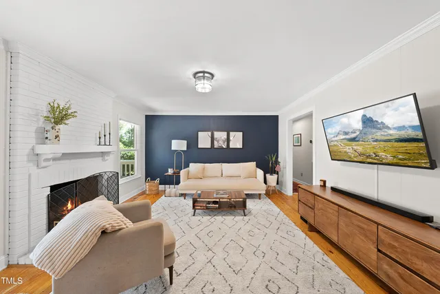 a living room with furniture and a fireplace