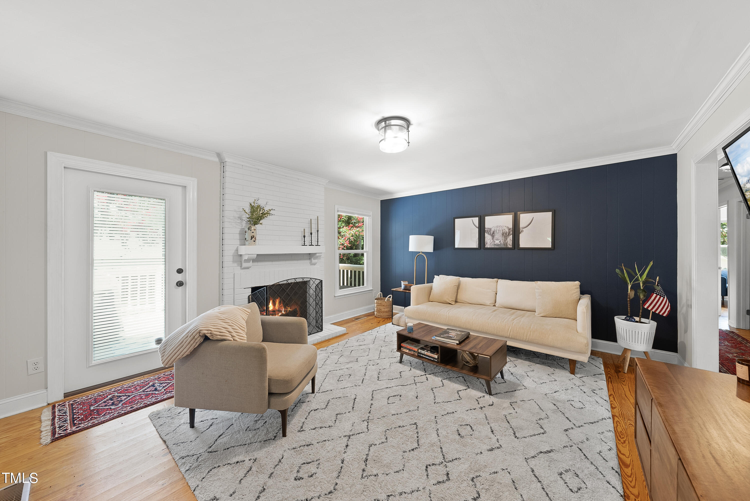 3116 Carovel Court Raleigh, NC 27612 - Photo 13 of 25 a living room with furniture and a fireplace