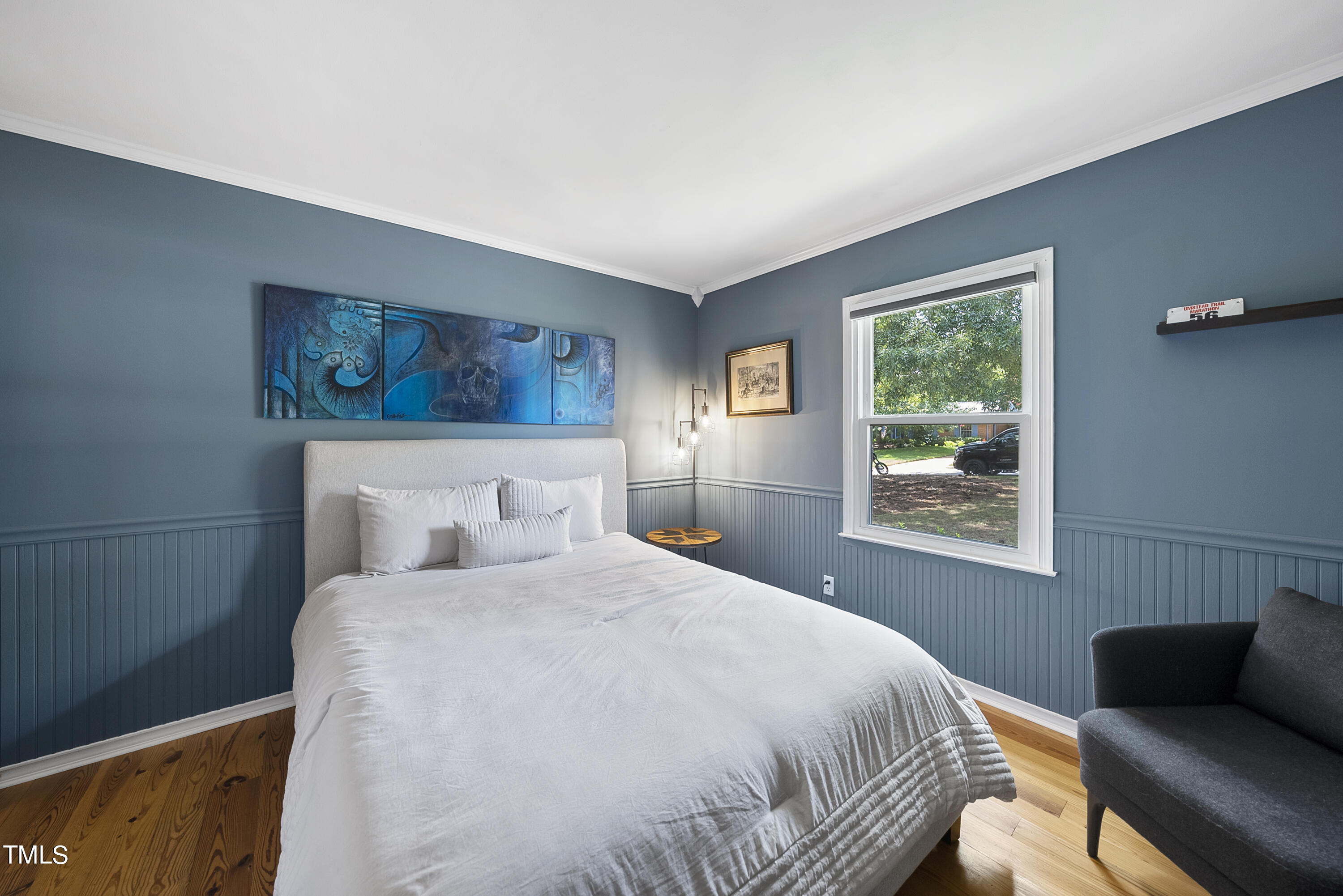 3116 Carovel Court Raleigh, NC 27612 - Photo 18 of 25 a bedroom with a bed and a window