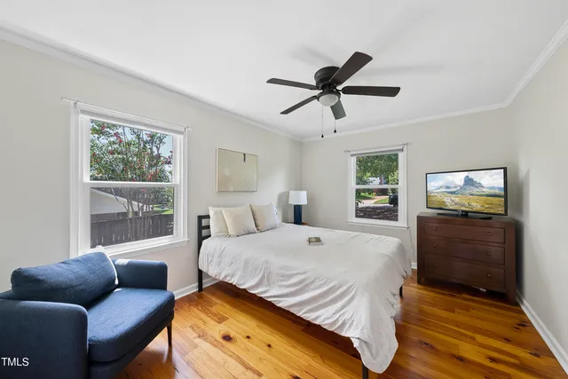 a bedroom with a bed and a couch