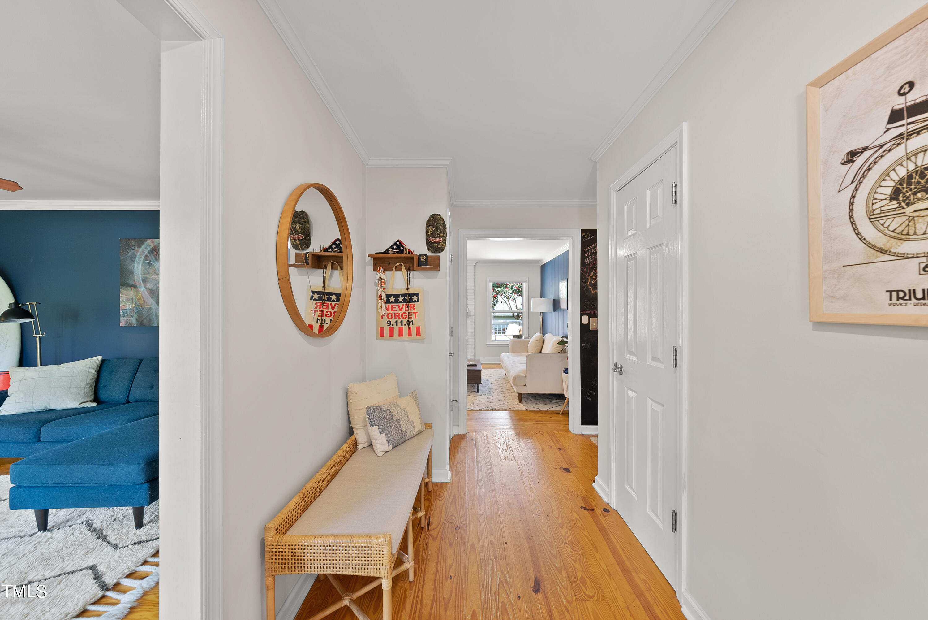 3116 Carovel Court Raleigh, NC 27612 - Photo 2 of 25 a view of a hallway with wooden floor and furniture