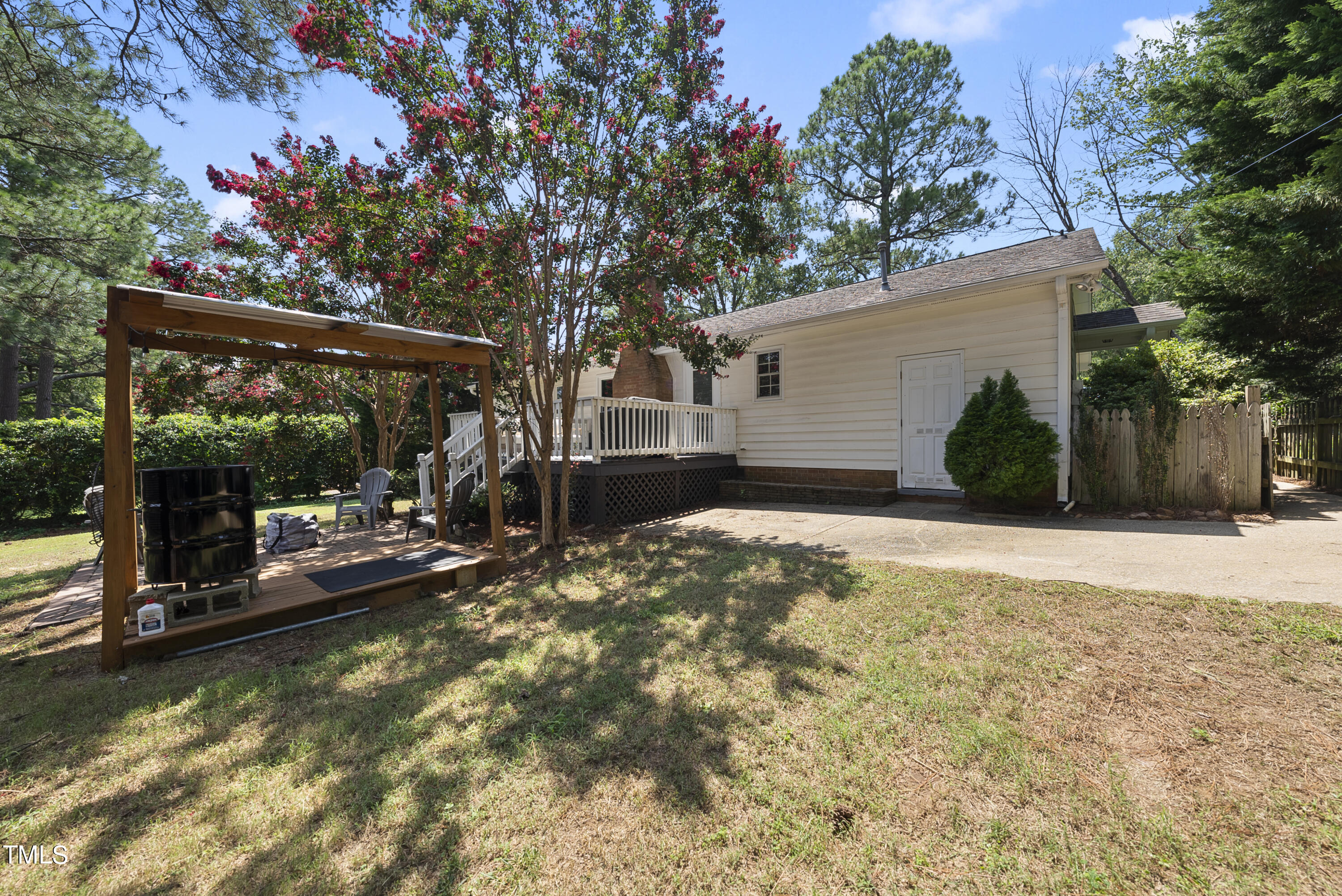 3116 Carovel Court Raleigh, NC 27612 - Photo 24 of 25 a view of a house with backyard and sitting area