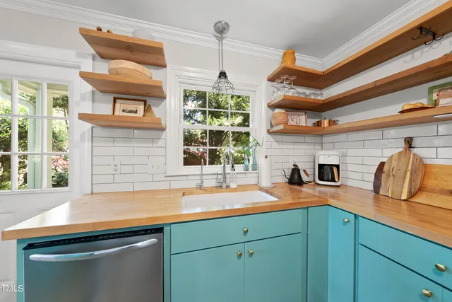 a kitchen with a sink and a window