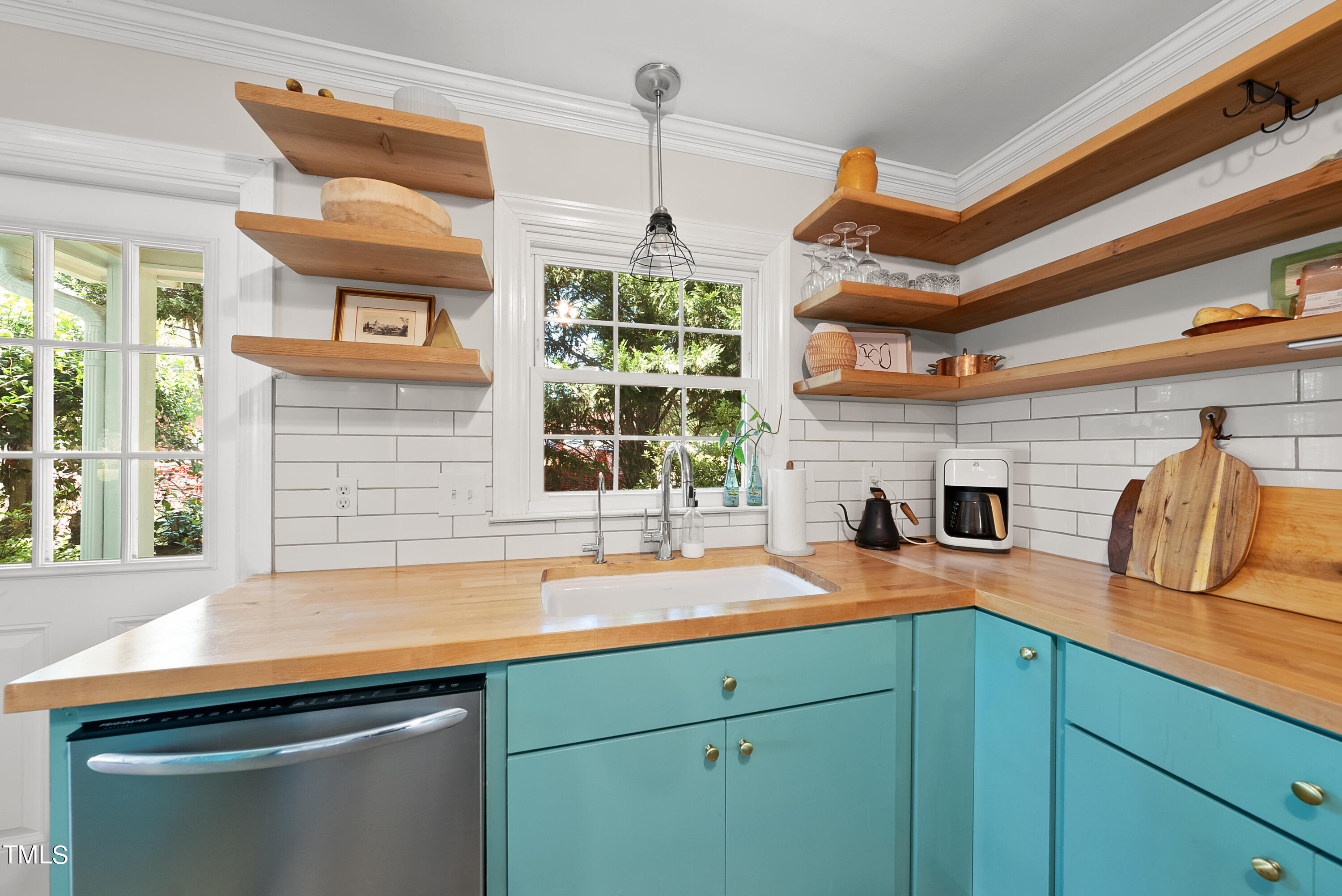 3116 Carovel Court Raleigh, NC 27612 - Photo 9 of 25 a kitchen with a sink and a window