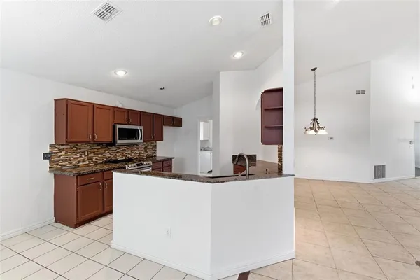 a view of an entryway with a chandelier