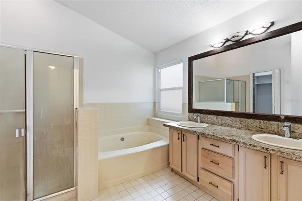 a bathroom with a bathtub and a shower