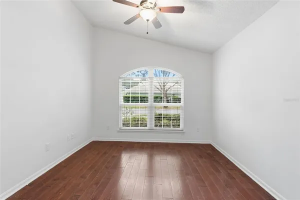 a room with a stove and a refrigerator