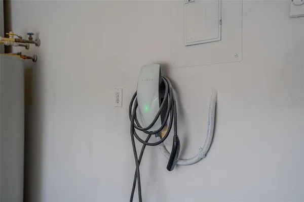 a view of a porch with furniture and a yard