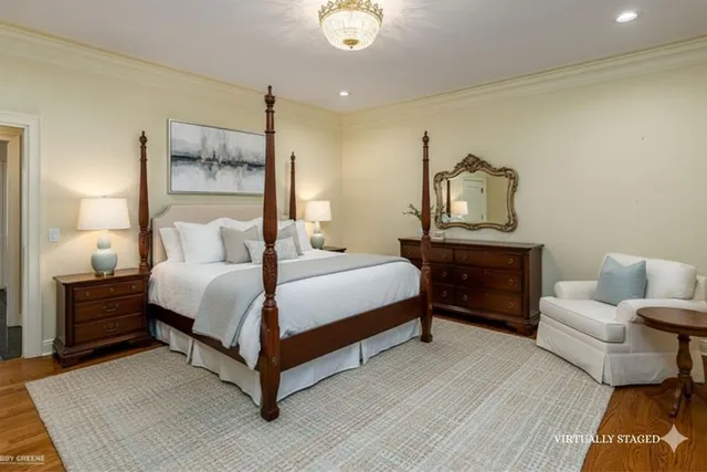 a bedroom with a bed lamps and fireplace