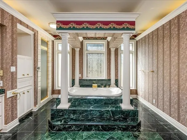 a living room filled with furniture and a chandelier