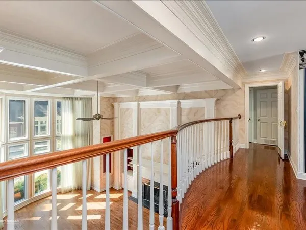 a view of an entryway with wooden floor