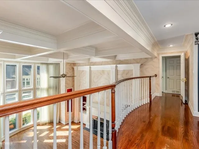 a view of an entryway with wooden floor