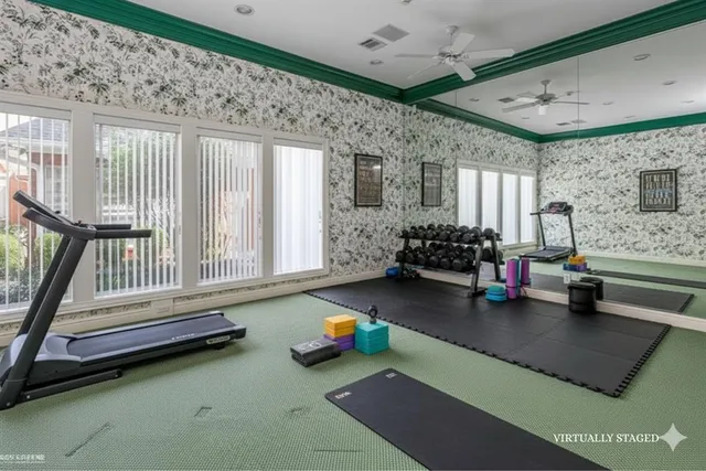 a children room with furniture and a large window