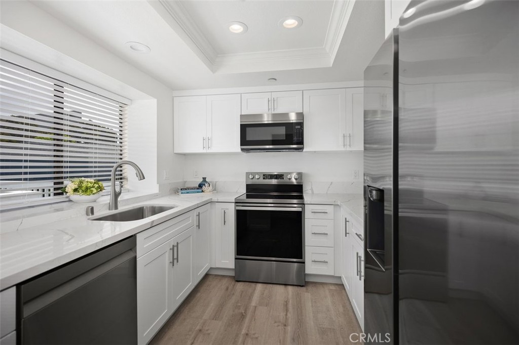 2031 Via Concha San Clemente, CA 92673 - Photo 2 of 29 a kitchen with a sink stove and refrigerator