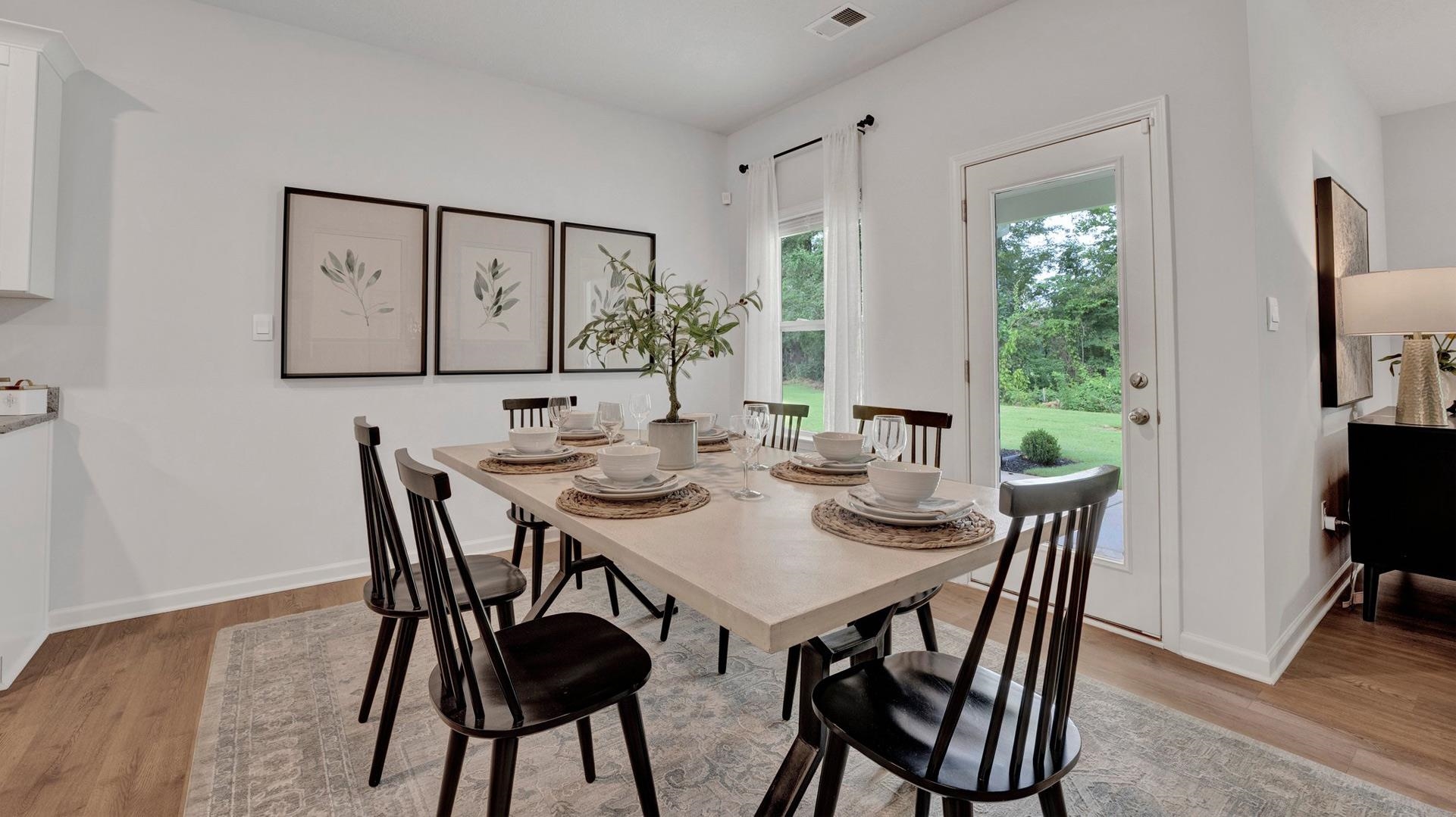 320 Windemere Loop Oakland, TN 38060 - Photo 11 of 28 a view of a dining room with furniture and wooden floor