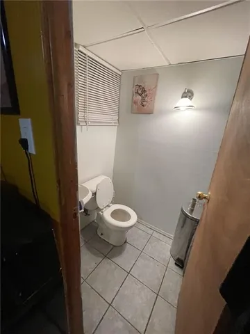 a bathroom with a toilet and a sink