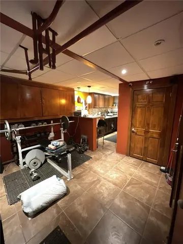 a bedroom with bed and wooden floor