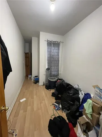 a view of kitchen with furniture and wooden floor