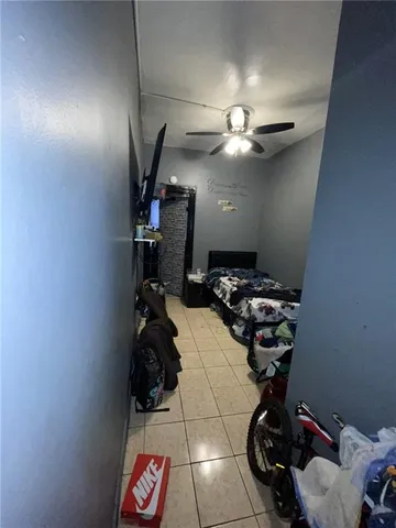 a bed room with furniture and a flat screen tv