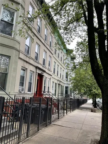 a view of a building with a tree