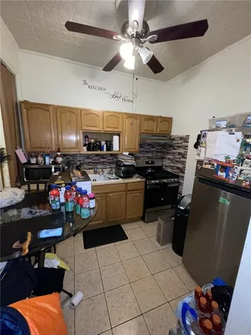 a bed sitting in a bedroom and chandelier