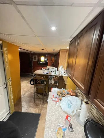 a bedroom with furniture and a flat screen tv