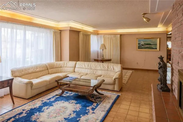 a living room with furniture and a rug