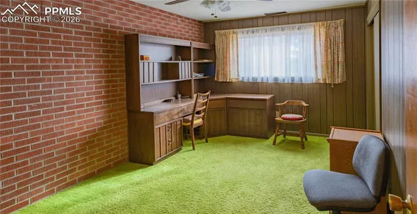 a workspace with furniture and window