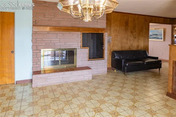a kitchen with wooden cabinets and a stove