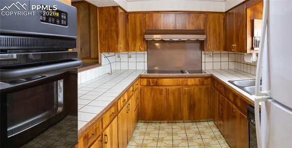 a living room with a couch and a fireplace