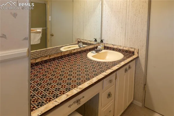 a bedroom with a bed and a potted plant