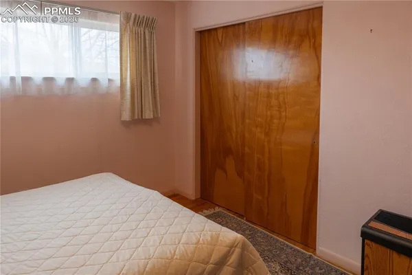 a view of a hallway with entryway and closet