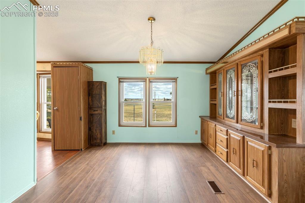 13335 Gymkhana Road Peyton, CO 80831 - Photo 18 of 38 Wood-finish flooring throughout