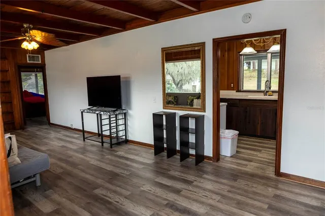 a view of livingroom with furniture wooden floor and window