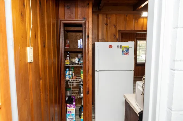 a white refrigerator freezer sitting in a kitchen