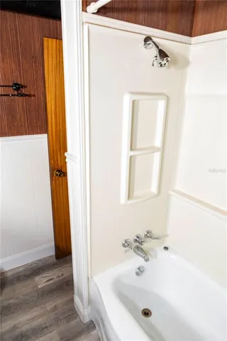 a bathroom with a tub and a sink