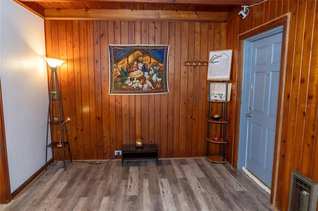 a view of front door with wooden floor