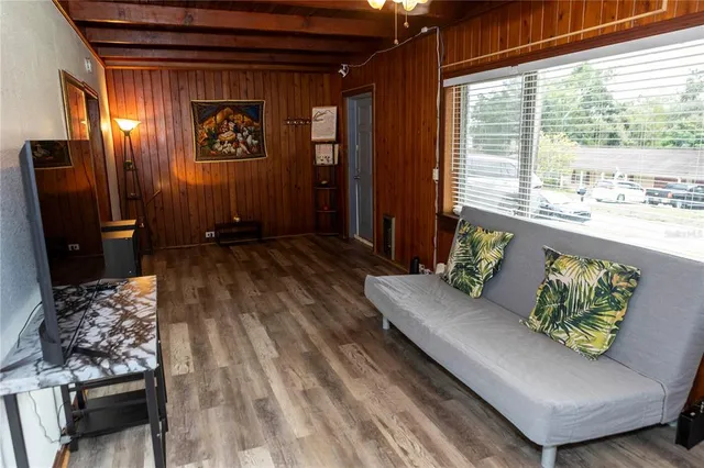 a living room with furniture and a window