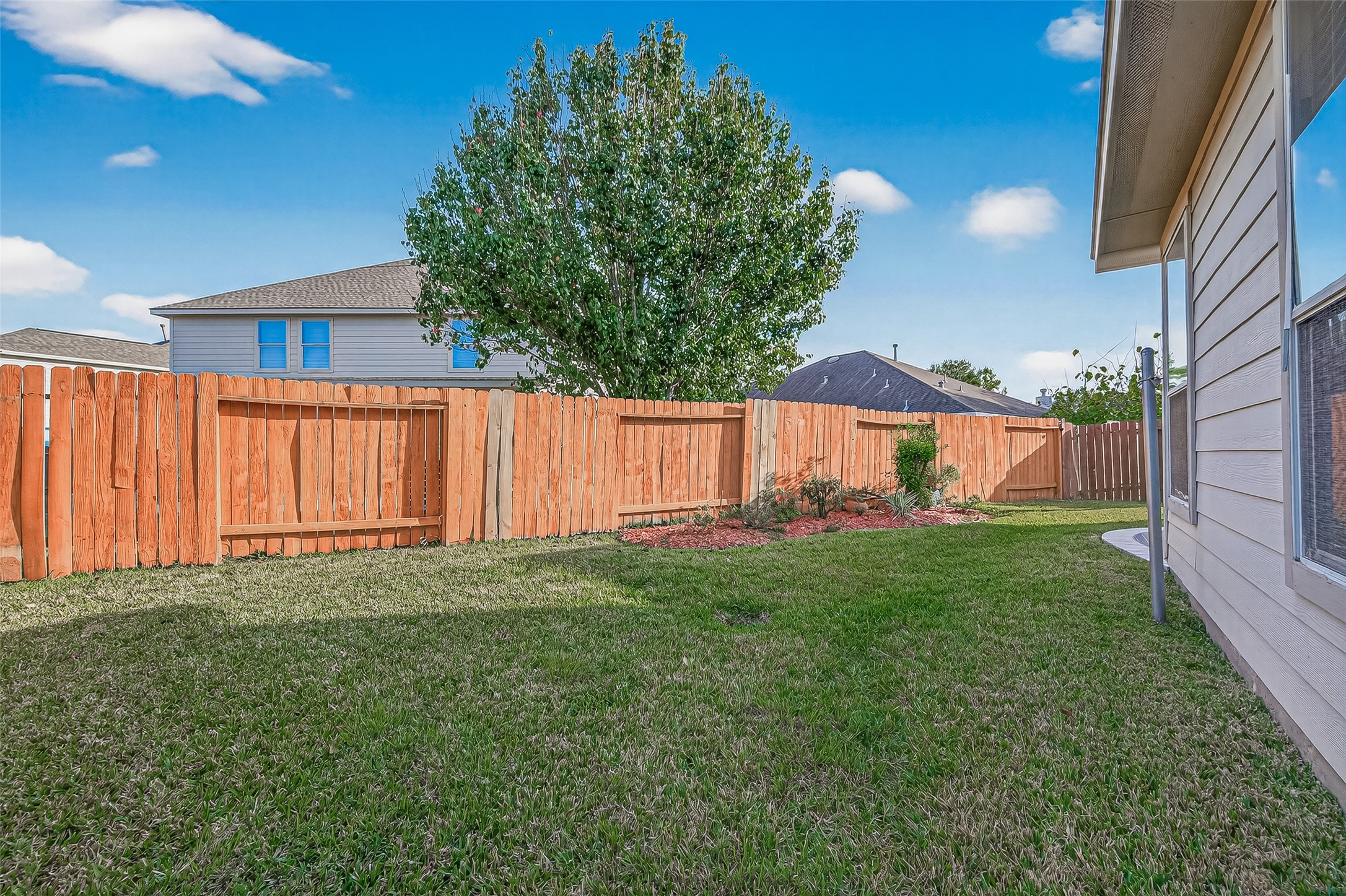 5103 Azalea Meadow Lane Katy, TX 77494 - Photo 19 of 34 a view of backyard with hardwood