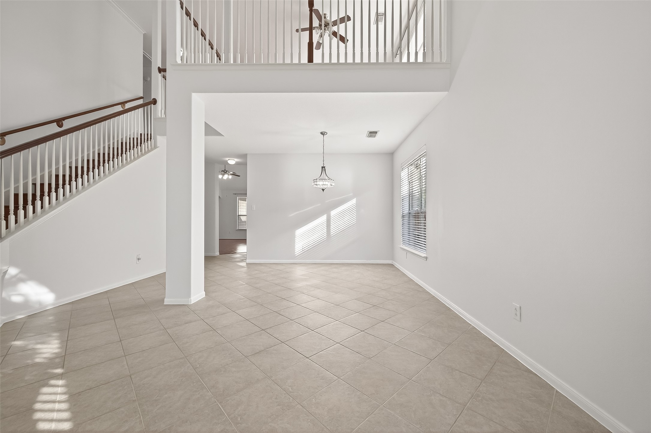 5103 Azalea Meadow Lane Katy, TX 77494 - Photo 20 of 34 a view of a hallway with entryway and kitchen