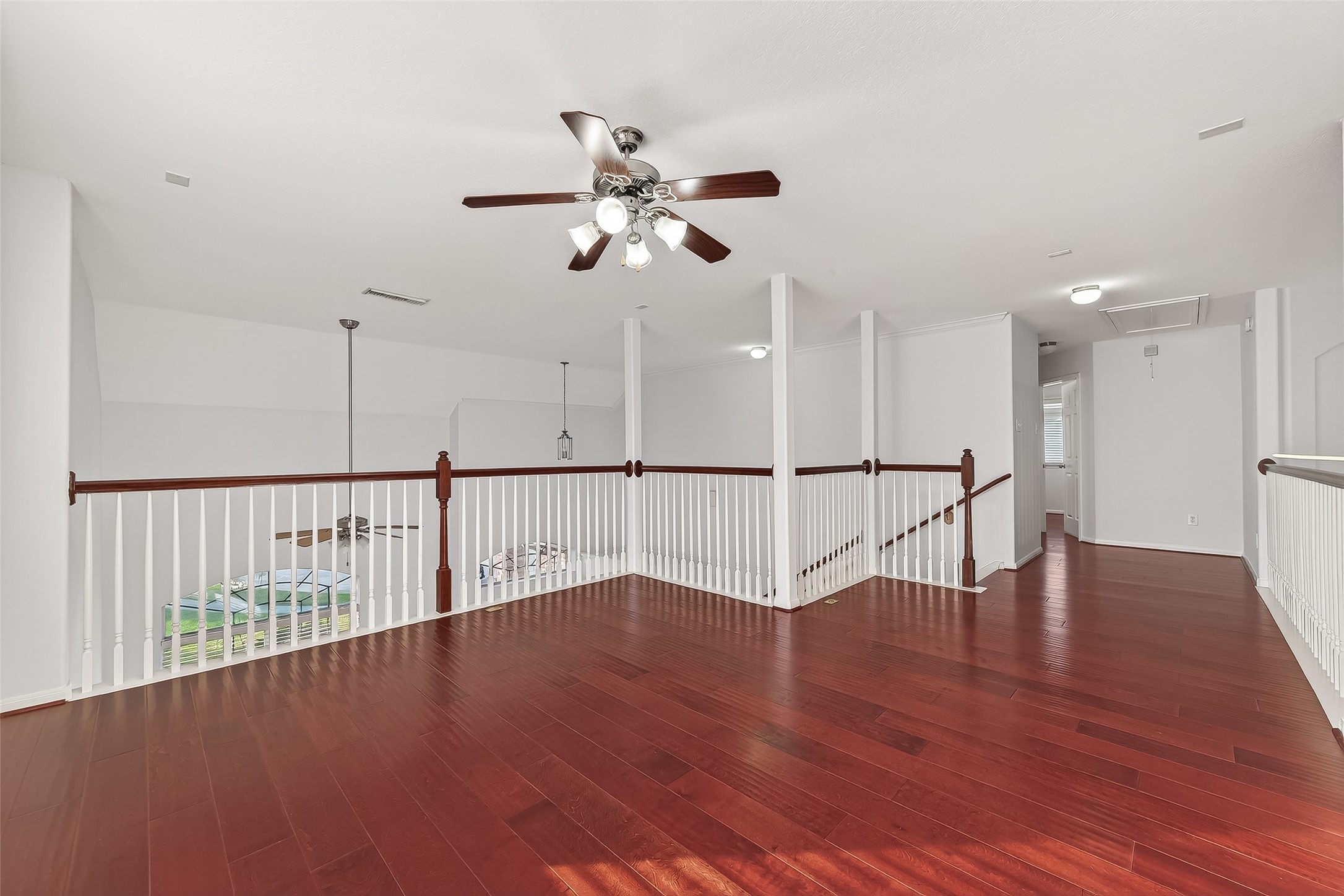 5103 Azalea Meadow Lane Katy, TX 77494 - Photo 27 of 34 a view of an empty room with wooden floor