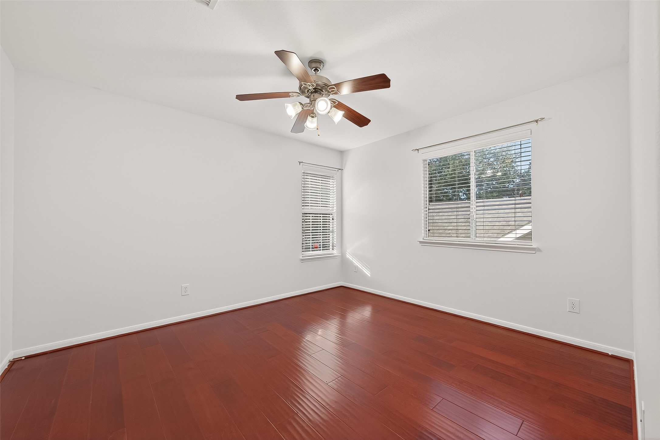 5103 Azalea Meadow Lane Katy, TX 77494 - Photo 28 of 34 a view of an empty room with wooden floor and a window