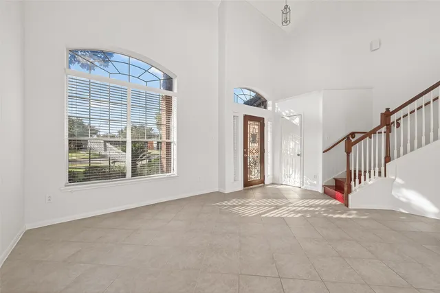 a view of an empty room with windows