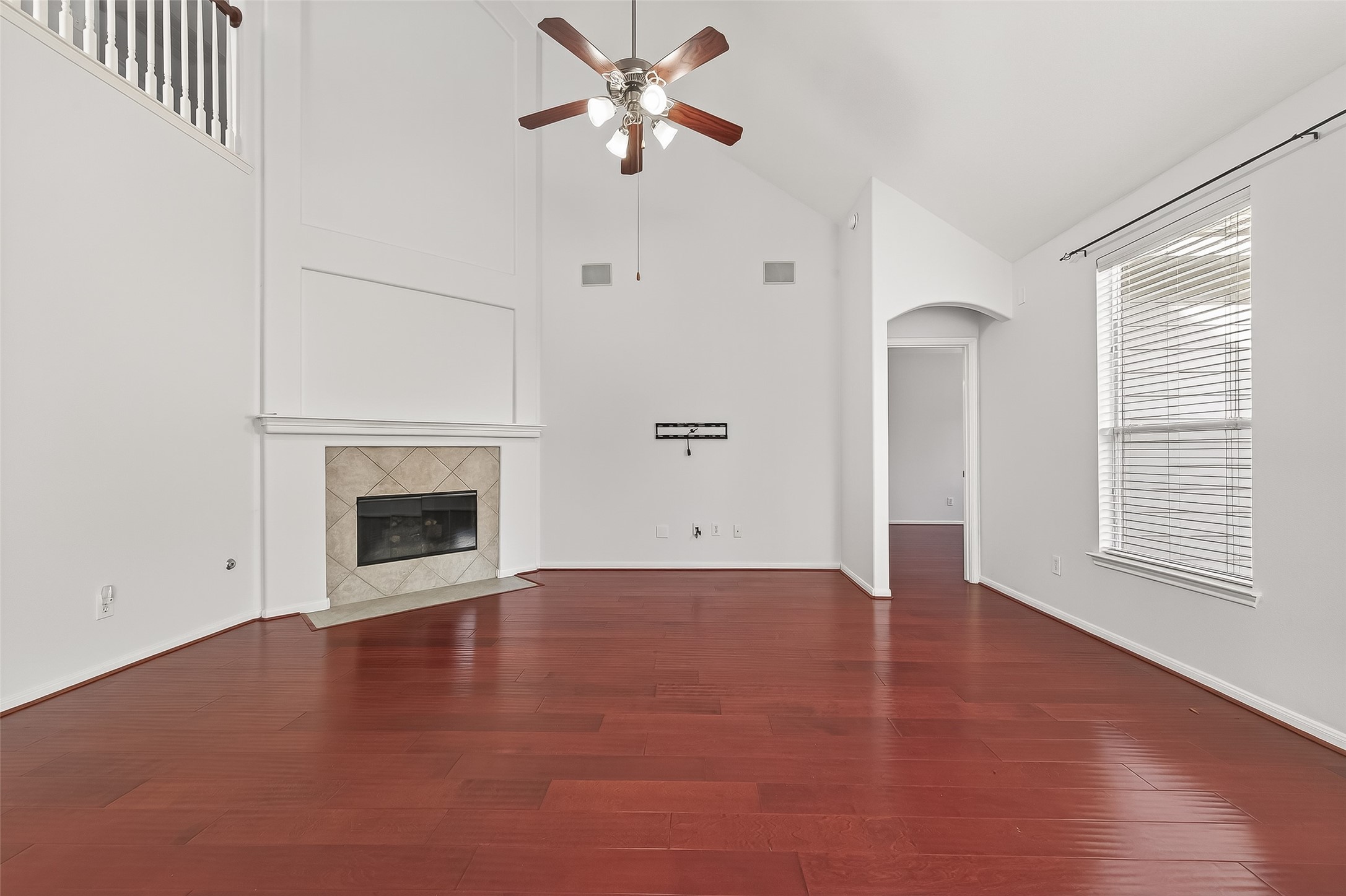5103 Azalea Meadow Lane Katy, TX 77494 - Photo 5 of 34 an empty room with windows and fireplace